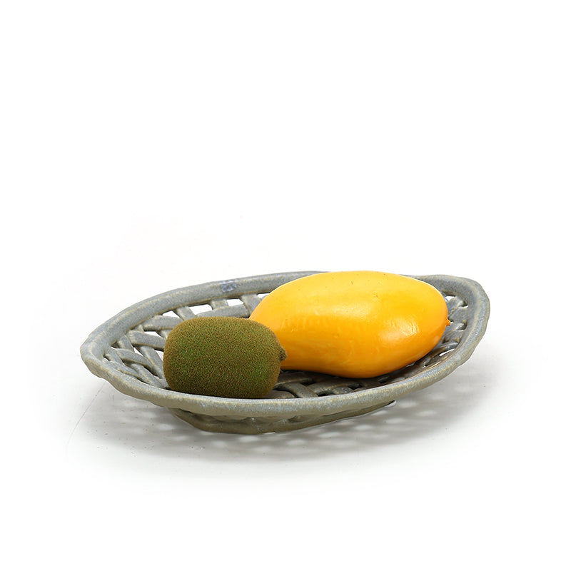 Woven ceramic basket with light coloured fruits Lattice hollow grapes or bananas or apples ceramic basket
