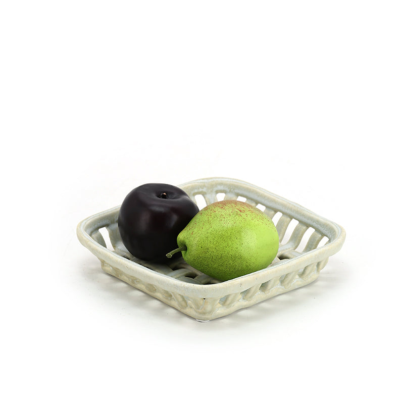 Woven ceramic basket with light coloured fruits Lattice hollow grapes or bananas or apples ceramic basket